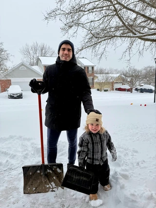 The author and one of his kids in the snow